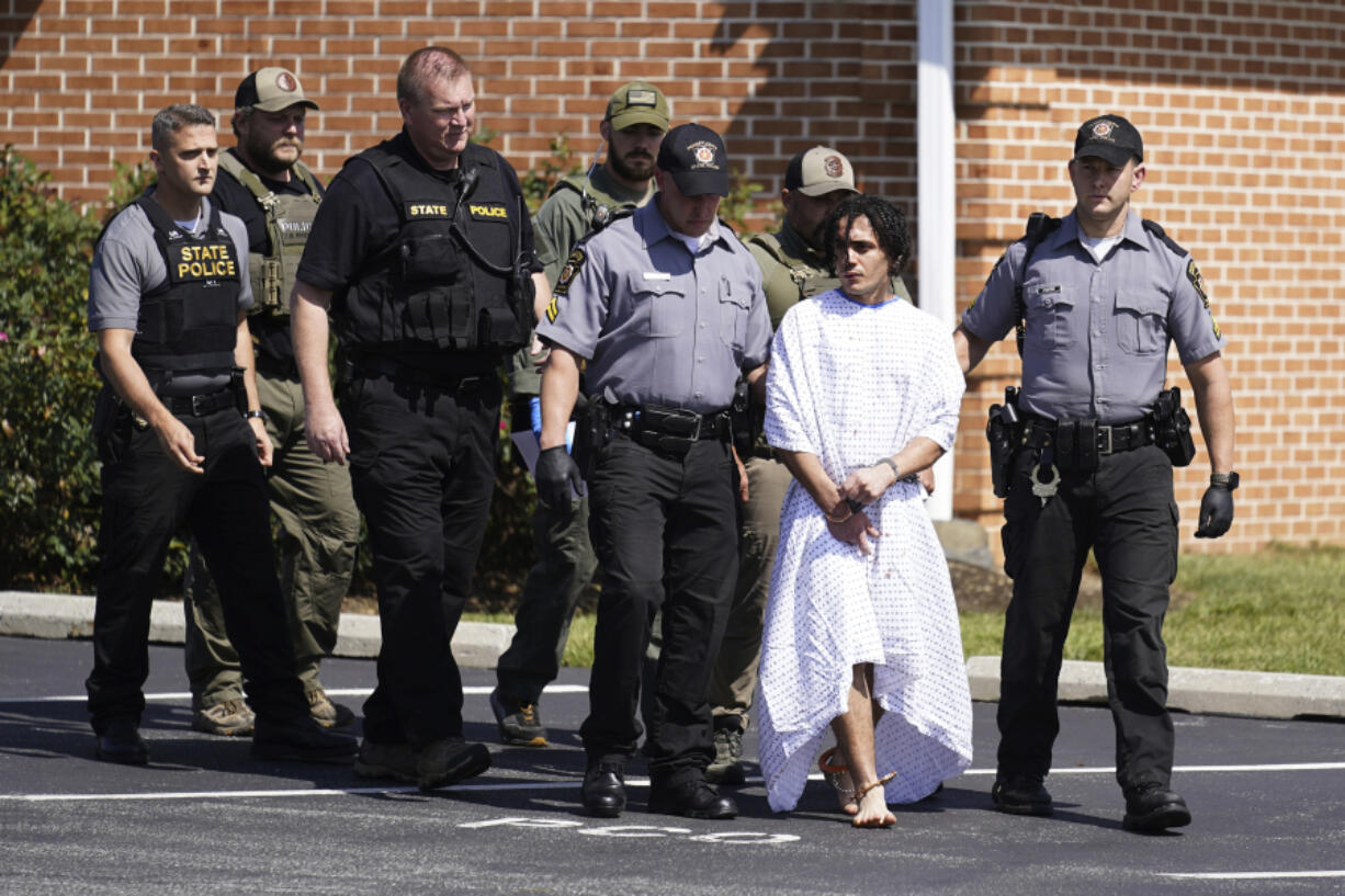 Law enforcement officers escort Danelo Cavalcante from a Pennsylvania State Police barracks in Avondale Pa., Wednesday, Sept. 13, 2023. Cavalcante was captured Wednesday after eluding hundreds of searchers for two weeks.