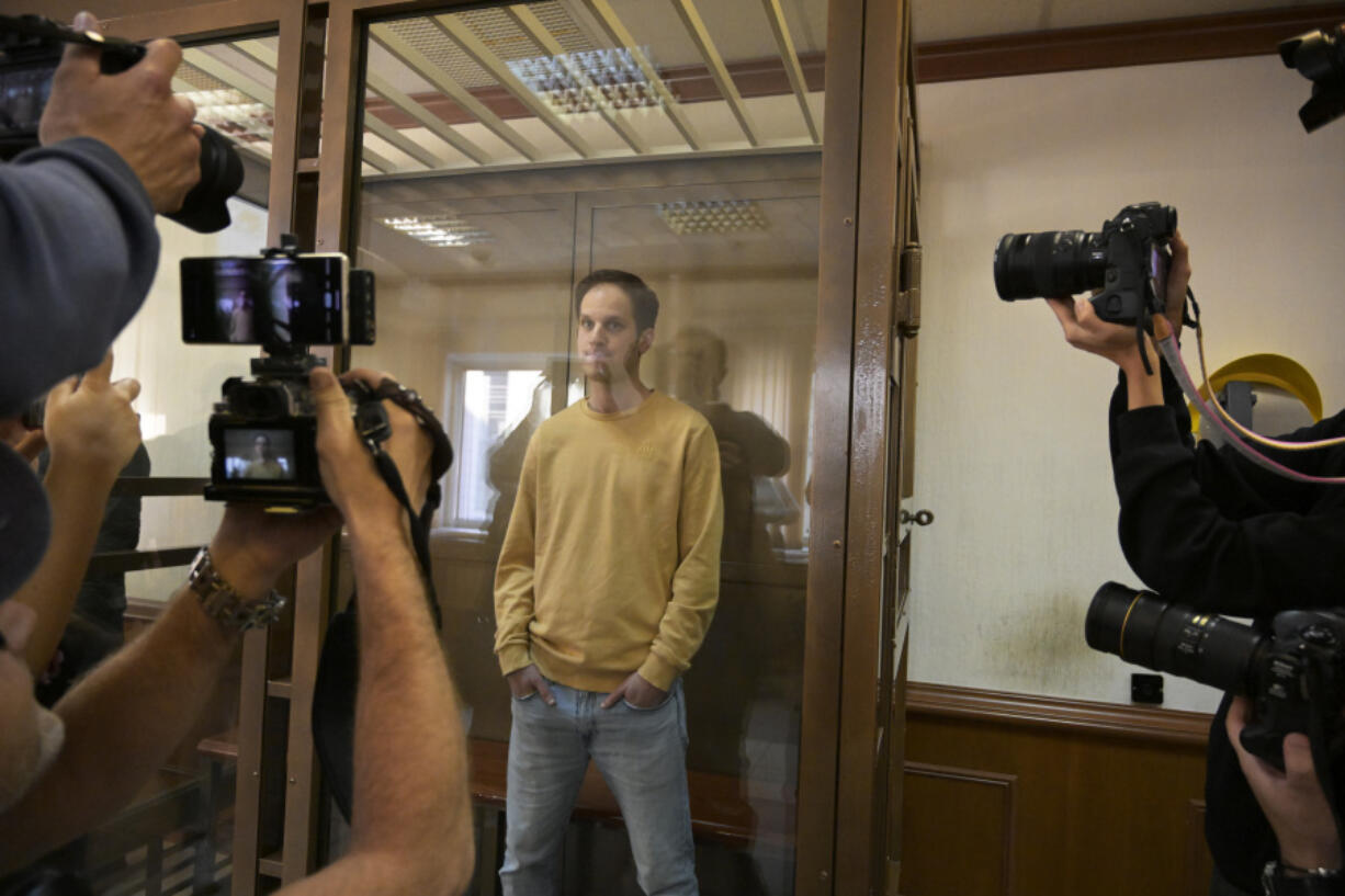 Wall Street Journal reporter Evan Gershkovich stands in a glass cage in a courtroom at the Moscow City Court, in Moscow, Russia, on Tuesday, Sept. 19, 2023. A Russian court on Tuesday is scheduled to hear a defense appeal of Wall Street Journal reporter Evan Gershkovich against the decision to extend his period of detention.