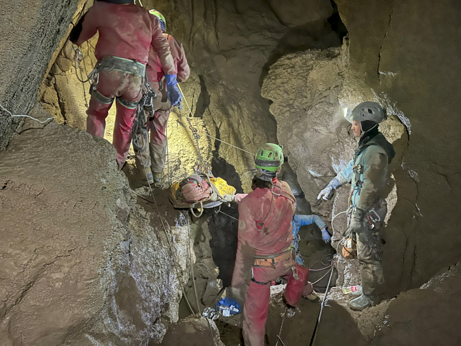 Members of the CNSAS, Italian alpine and speleological rescuers, carry a stretcher with American researcher Mark Dickey during a rescue operation in the Morca cave, near Anamur, southern Turkey, Monday, Sept. 11, 2023. A rescue operation is underway in Turkey's Taurus Mountains to bring out an American researcher who fell seriously ill at a depth of some 1,000 meters (3,000 feet) from the entrance of one of world's deepest caves last week and was unable to climb out himself. Mark Dickey is being assisted by international rescuers who by Monday had brought him up to 300 meters (nearly 1,000 feet).