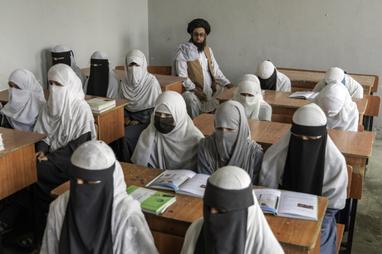 FILE - Afghan girls attend a religious school, which remained open since the last year's Taliban takeover, in Kabul, Afghanistan, on Aug. 11, 2022. Two years after the Taliban banned girls from school beyond sixth grade, Afghanistan is the only country in the world with restrictions on female education. Now, the rights of Afghan women and children are on the agenda of the United Nations General Assembly Monday, Sept. 18, 2023, in New York.
