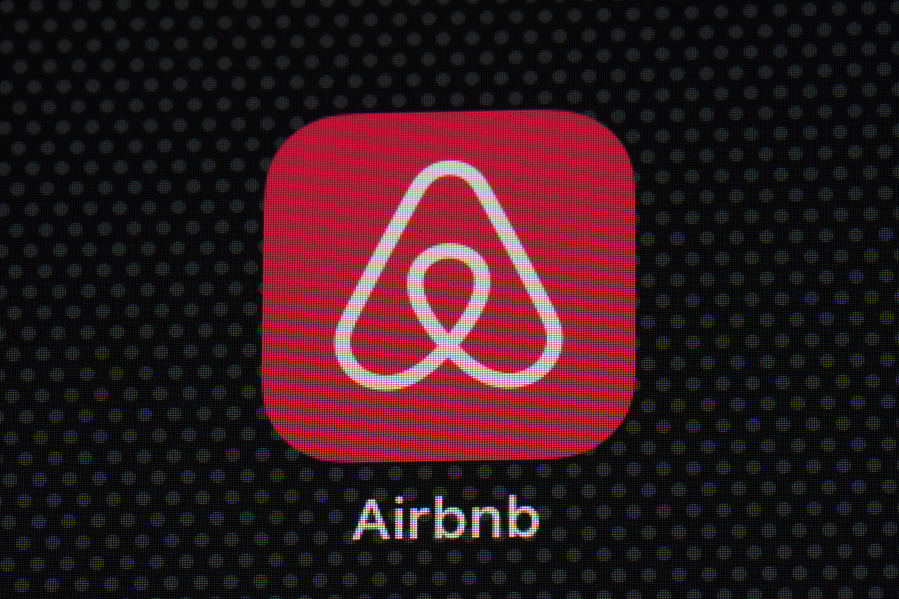 FILE - The Airbnb app icon is displayed on an iPad screen in Washington, D.C., on May 8, 2021. Airbnb says it's cracking down on fake listings, which are emerging as a major problem for customers of the short-term rental site. Airbnb said Wednesday Sept. 20 2023 it has removed 59,000 fake listings and blocked another 157,000 from joining the site this year. Fake listings and high cleaning fees are among several issues that customers are raising with Airbnb.