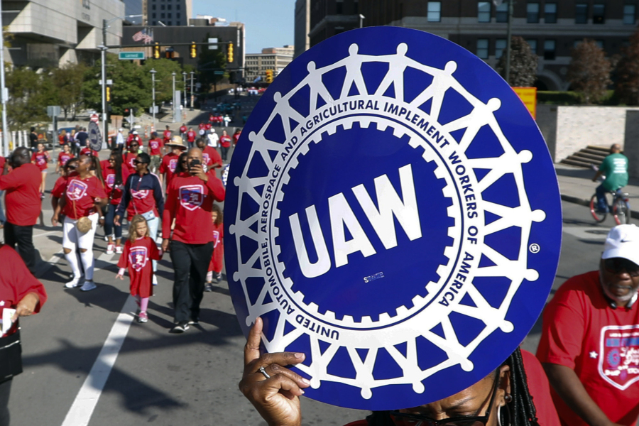 FILE - United Auto Workers members walk in the Labor Day parade in Detroit, Sept. 2, 2019. Auto workers are voting overwhelmingly to give union leaders the authority to call strikes against Detroit car companies if a contract agreement isn't reached. The United Auto Workers union said Friday, Aug. 25, 2023, that results are still being tallied, but so far 97% have voted in favor of authorizing one or more strikes against Stellantis, General Motors and Ford.