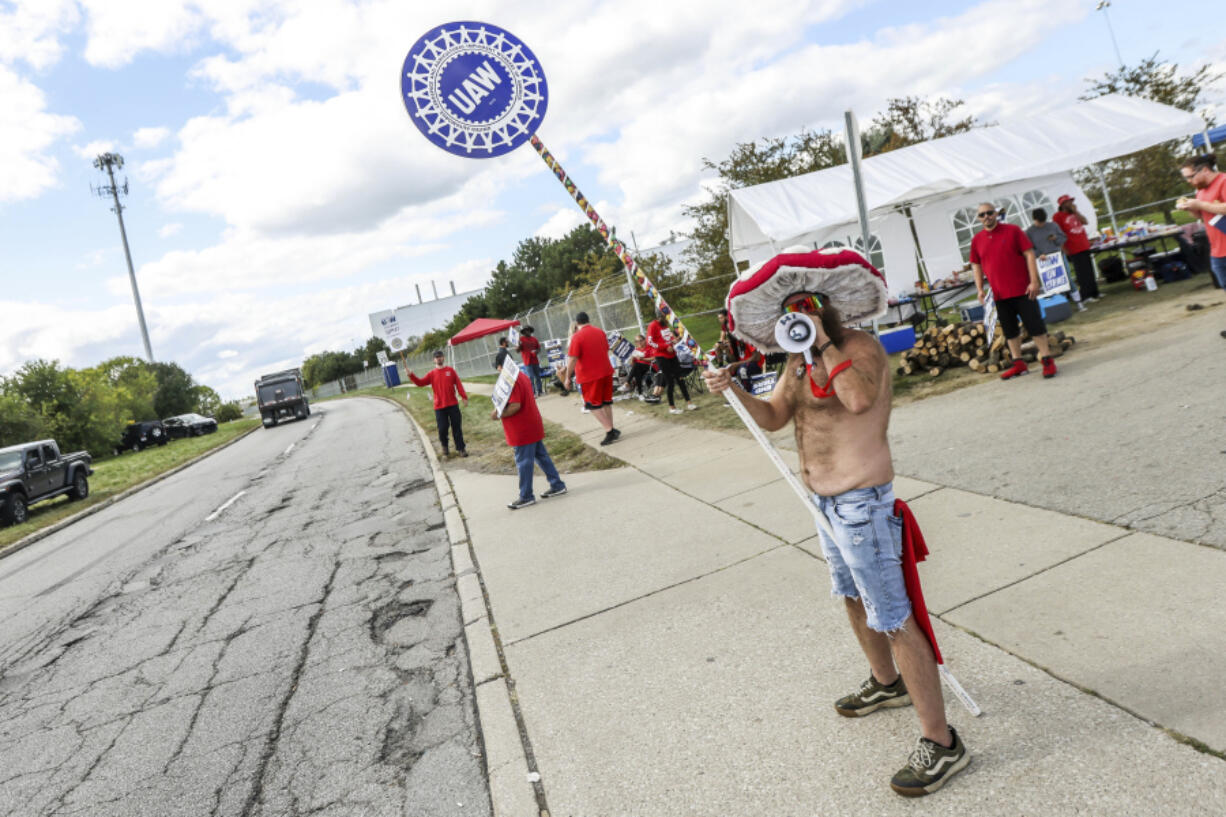 United Auto Workers member Ben Smith from engine team 43 goes shirtless while picketing outside the Stellantis Toledo Assembly Complex on Monday, Sept. 18, 2023 in Toledo, Ohio.