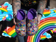 Christina Martin, of Rosamond, California, holds Lisa Frank Crocs that her sister gave her as a birthday gift. Martin has been a Lisa Frank fan since she was a child.