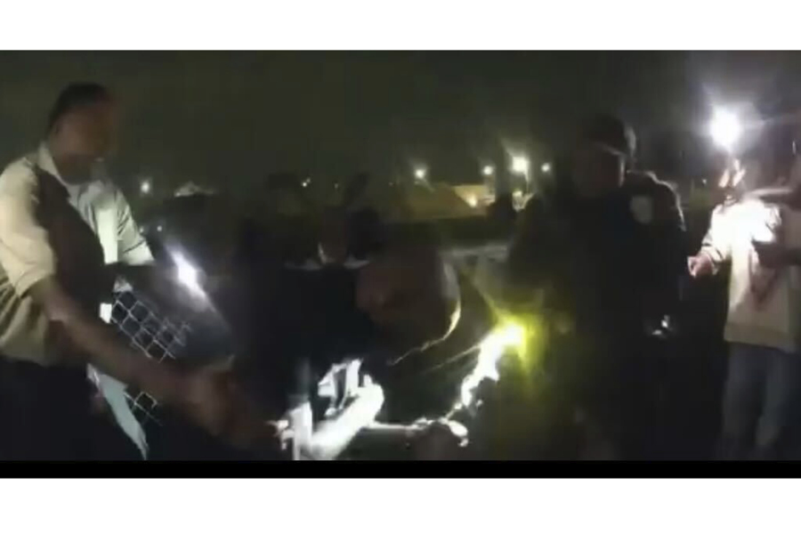 In an image made from video released by the Birmingham Police Dept., a high school band director is being tasered and arrested after refusing to stop his band from playing after a football game, Thursday, Sept. 14, 2023, in Birmingham, Ala. (Birmingham Police Dept.