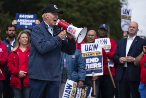President Joe Biden speaks to striking United Auto Workers on the picket line outside the Willow Run Redistribution Center, UAW Local 174, Tuesday, Sept. 26, 2023, in Van Buren Township, Mich.