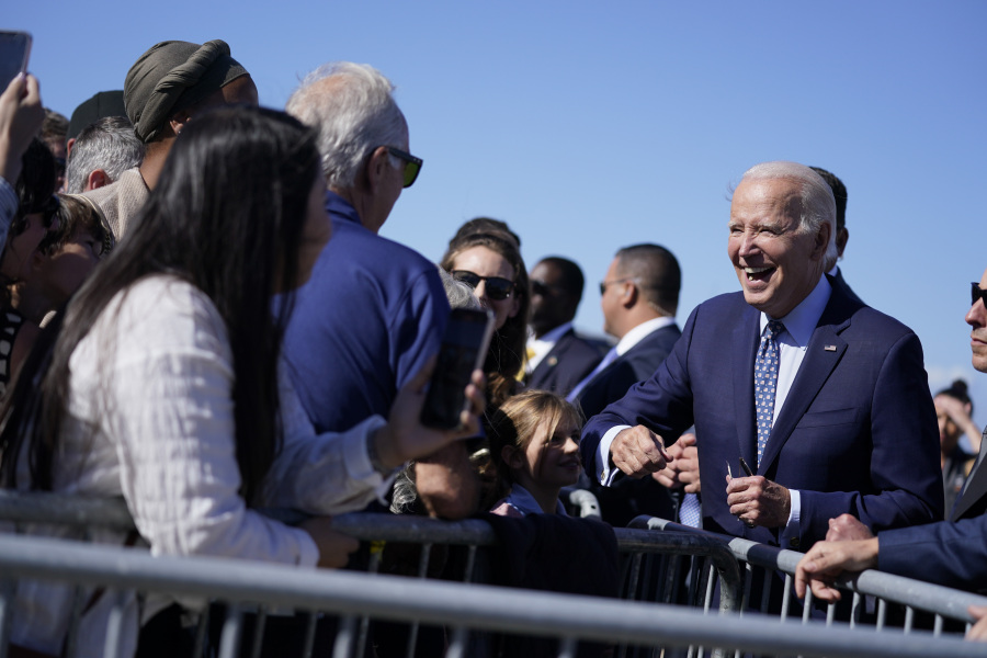 President Joe Biden greets supporters on the tarmac as he arrives at Moffett Federal Field for a campaign fundraising event, Tuesday, Sept. 26, 2023, in Mountain View, Calif.