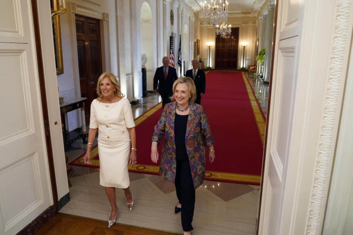 First lady Jill Biden and former Secretary of State Hillary Clinton arrive to speak during an event to celebrate the 2023 Praemium Imperiale Laureates, a global arts prize awarded annually by the Japan Art Association for lifetime achievement in the arts, in the East Room of the White House, Tuesday, Sept. 12, 2023, in Washington.