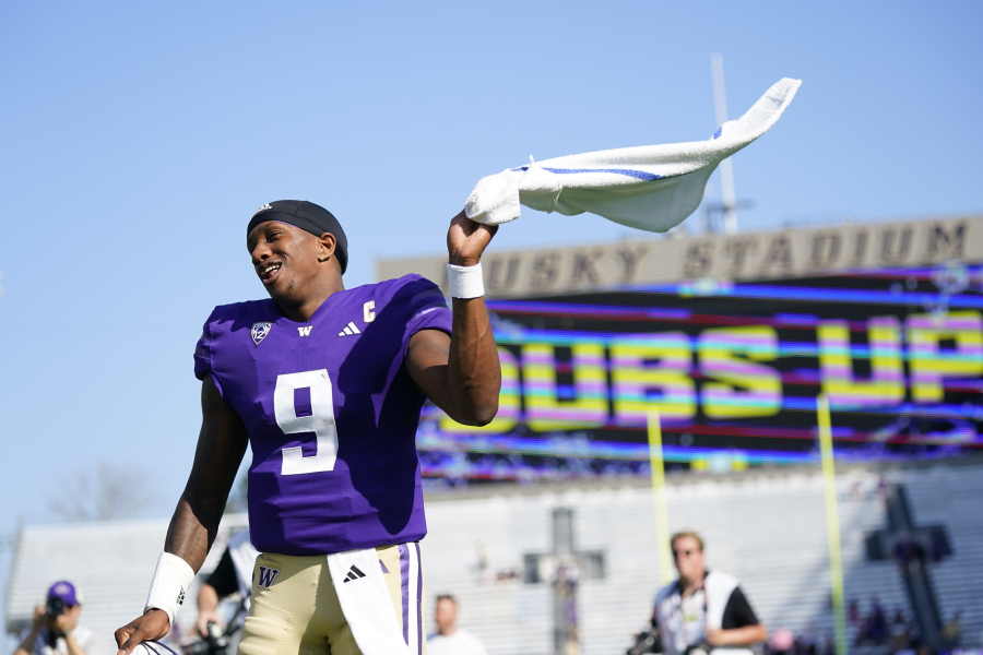 Washington quarterback Michael Penix Jr. waves a towel while celebrating a 56-19 win over Boise State in an NCAA college football game, Saturday, Sept. 2, 2023, in Seattle.