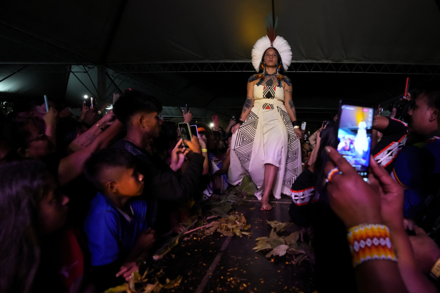 An Indigenous model wears a creation from Indigenous designers during a fashion event Tuesday in Brasilia, Brazil.