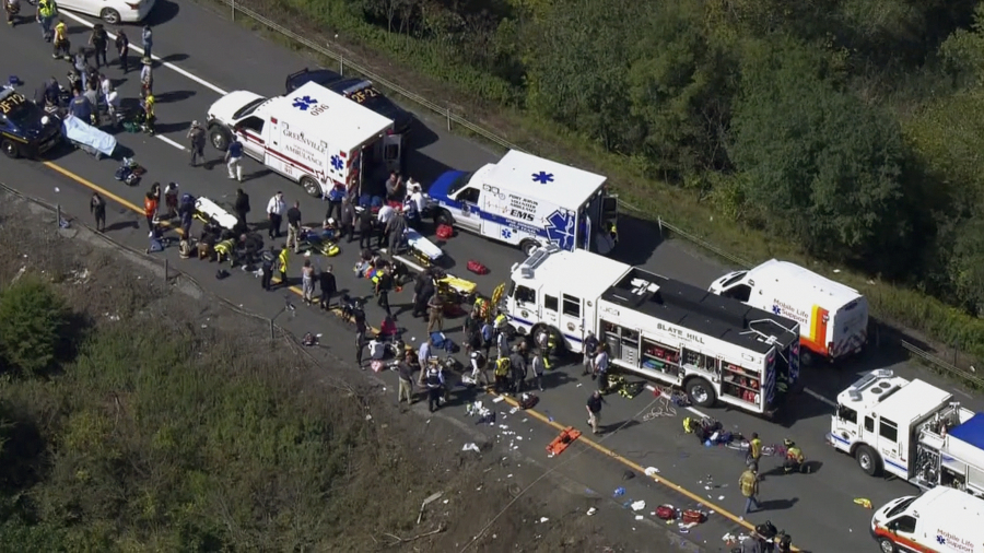 Emergency responders work the scene of a fatal bus crash, in Wawayanda, N.Y., Thursday, Sept. 21, 2023. The charter bus carrying high school students to a band camp hurtled off a New York highway and down an embankment, officials said.