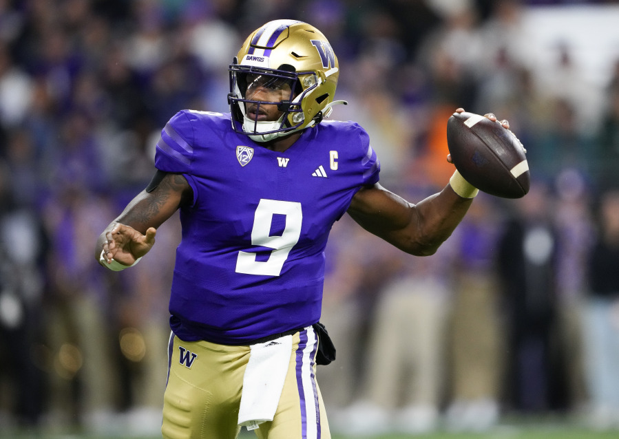 Washington quarterback Michael Penix Jr. looks for a receiver during the first half of the team's NCAA college football game against California on Saturday, Sept. 23, 2023, in Seattle.
