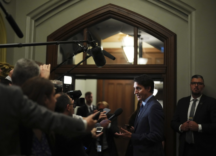 Prime Minister Justin Trudeau talks to media on his way to a cabinet meeting on Parliament Hill in Ottawa on Tuesday, Sept. 19, 2023. On Monday, Sept. 18, Canada expelled a top Indian diplomat as it investigates what Trudeau called credible allegations that India's government may have had links to the assassination in Canada of a Sikh activist. Trudeau told Parliament that he brought up the slaying with Modi at the G-20.