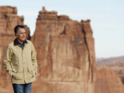 In this Saturday, March 3, 2018, photo, shows Mitt Romney walking during a tour of Arches National Park, near Moab, Utah. Romney announced earlier this month he won't seek a second term, saying younger people needed to step forward. In so doing, he threw open a wider door for those seeking to enter the race and led to speculation about whether Utah voters will choose a politically moderate successor similar to him or a farther-right figure such as Utah's other U.S. senator, Mike Lee, a Trump supporter.