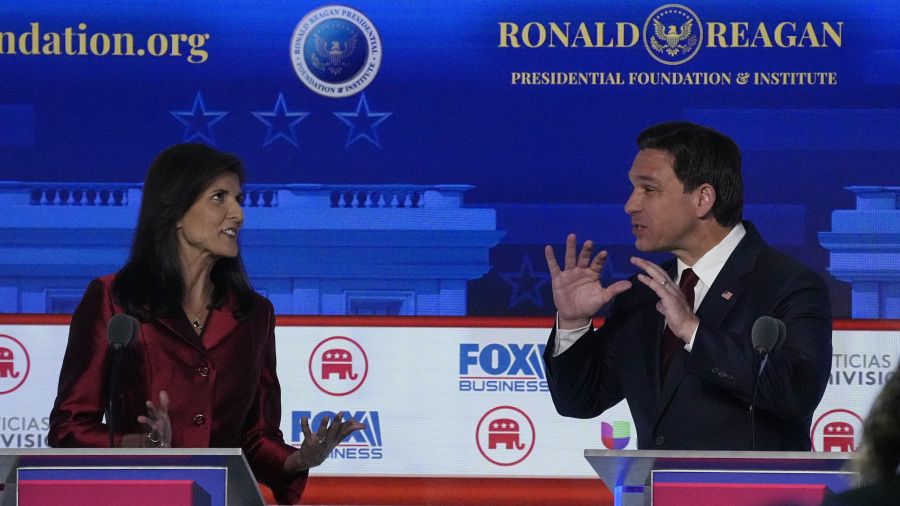 Former U.N. Ambassador Nikki Haley, left, argues a point with Florida Gov. Ron DeSantis during a Republican presidential primary debate hosted by FOX Business Network and Univision, Wednesday, Sept. 27, 2023, at the Ronald Reagan Presidential Library in Simi Valley, Calif. (AP Photo/Mark J.