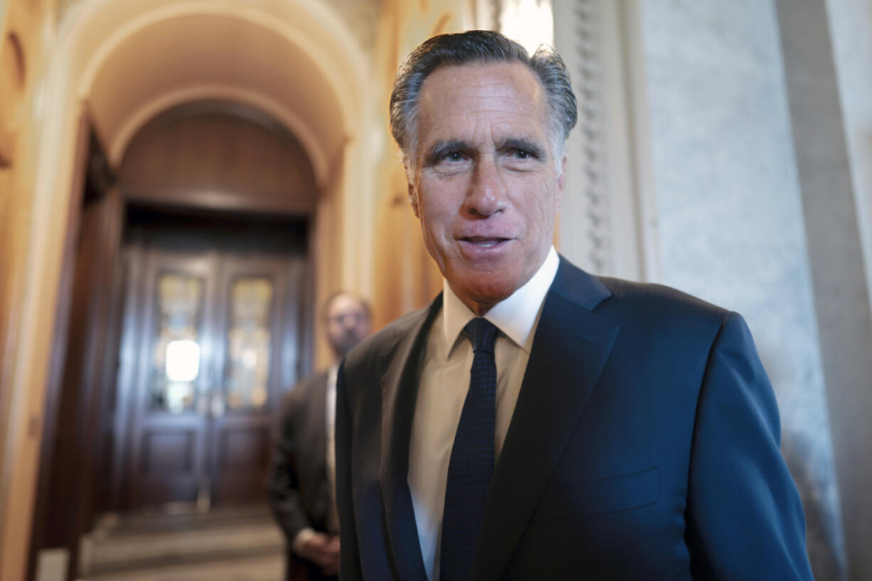 FILE - Sen. Mitt Romney, R-Utah, and other senators arrive at the chamber for votes, at the Capitol in Washington, Wednesday, Sept. 6, 2023. Romney will not run for reelection in 2024. The former presidential candidate and Massachusetts governor announced his intentions in a video statement Wednesday. (AP Photo/J.
