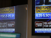 A monitor displays information about the Federal Reserve interest rate on the floor at the New York Stock Exchange in New York, Wednesday, Sept. 20, 2023. The Federal Reserve left its key interest rate unchanged for the second time in its past three meetings, a sign that it's moderating its fight against inflation as price pressures have eased.