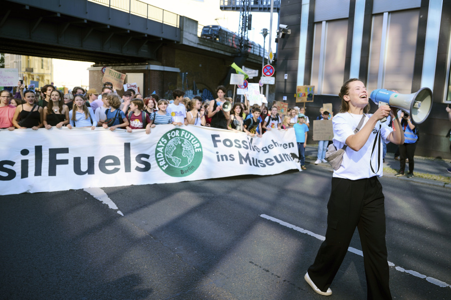 Climate activist Luisa Neubauer motivates the demonstrators during a ''Fridays for Future'' protest in Berlin, Germany, Friday Sept. 15, 2023.