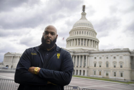 TSA employee John Hubert of Miami poses for a portrait on Capitol Hill, Friday, Sept. 22, 2023, in Washington.  Hubert, an airport security officer in Fort Lauderdale, Fla., recalls helping fellow Transportation Security Administration workers get essentials from food banks when they worked without pay during the last government shutdown.