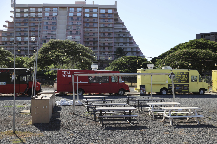 Food trucks which mostly cater to tourists from hotels in the area remain closed several weeks after wildfires devastated the town of Lahaina, Friday, Sept. 1, 2023, in Kahana, Hawaii. So few tourists are coming to the Hawaiian island of Maui after last month's wildfires that restaurants and tour companies are laying off workers and unemployment is surging. State tourism officials initially urged travelers to stay away but now want them to come back so long as they refrain from going to the burn zone and surrounding area.