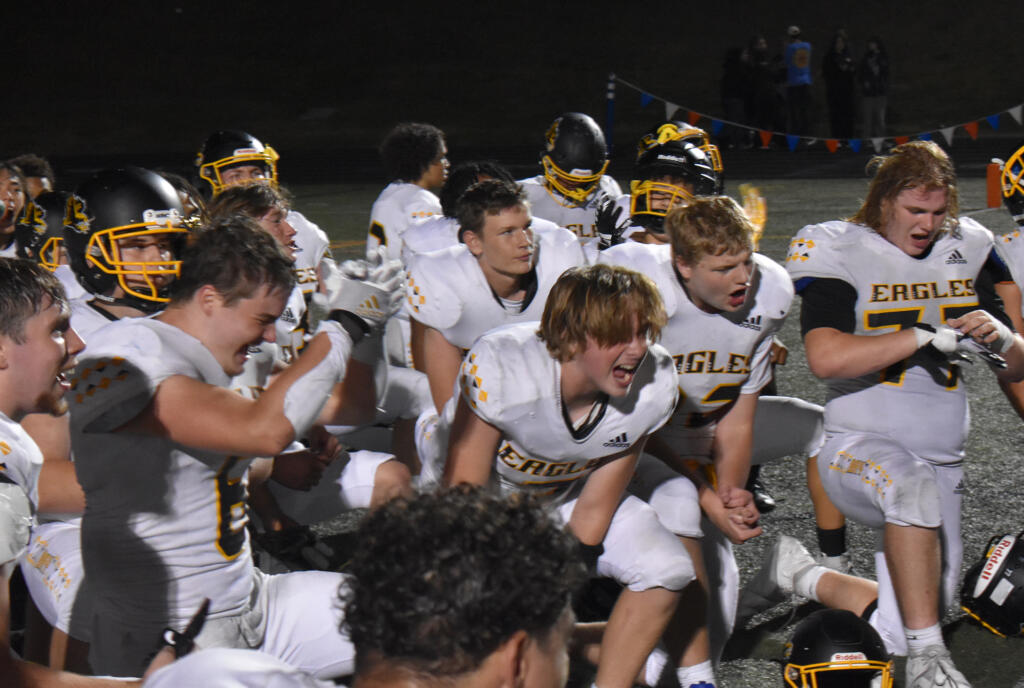 Hudson's Bay players celebrate after the Eagles' 28-24 win over Ridgefield at Ridgefield High School on Friday, Sept. 22, 2023.