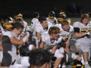 Hudson's Bay players celebrate after the Eagles' 28-24 win over Ridgefield at Ridgefield High School on Friday, Sept. 22, 2023.