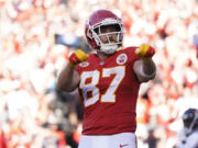 File - Kansas City Chiefs tight end Travis Kelce celebrates after scoring during the second half of an NFL football game against the Chicago Bears Sunday, Sept. 24, 2023, in Kansas City, Mo.  Following Taylor Swift's appearance at the game, jersey sales for the All-Pro tight-end seemingly skyrocketed.