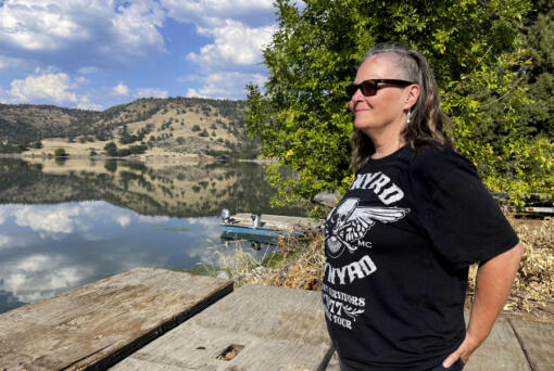 Sami Jo Difuntorum, Cultural Preservation Officer, Shasta Indian Nation, looks out on Sunday, Sept. 17, 2023, at a reservoir from Copco 1 damn, that will be drawn down next year as part of the largest dam removal project in United States history. The Shasta Indian Nation hopes to reclaim some of its land which was flooded when the dams were built a century ago.