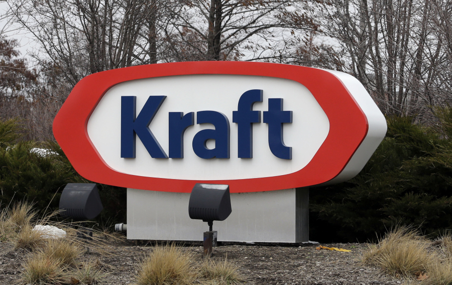 FILE - This March 25, 2015, file photo shows the Kraft logo outside of the company's headquarters in Northfield, Ill. Kraft Heinz is recalling individually-wrapped Kraft Singles American processed cheese slices because part of the wrapper could stick to the slice and become a choking hazard. (AP Photo/Nam Y.