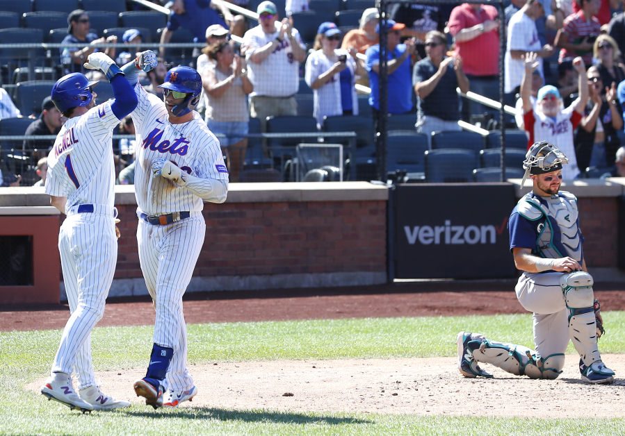 New York Mets' Pete Alonso (20) Jeff McNeil (1) celebrate after hitting a home run against the Seattle Mariners during the third inning of a baseball game, Sunday, Sept. 3, 2023 in New York. (AP Photo/Noah K.