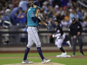 Seattle Mariners pitcher Logan Gilbert reacts after giving up a home run to New York Mets' Brandon Nimmo during the sixth inning of a baseball game Friday, Sept. 1, 2023, in New York.