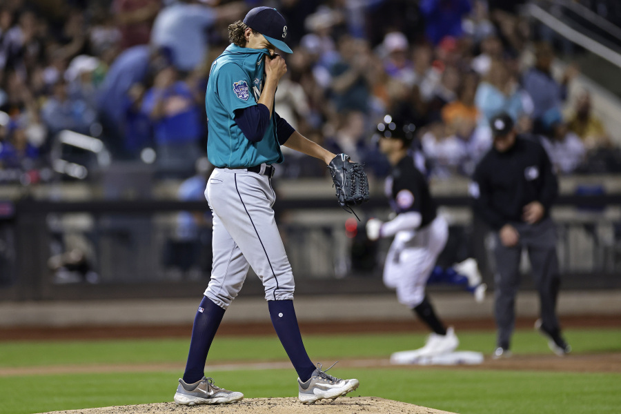 Seattle Mariners pitcher Logan Gilbert reacts after giving up a home run to New York Mets' Brandon Nimmo during the sixth inning of a baseball game Friday, Sept. 1, 2023, in New York.