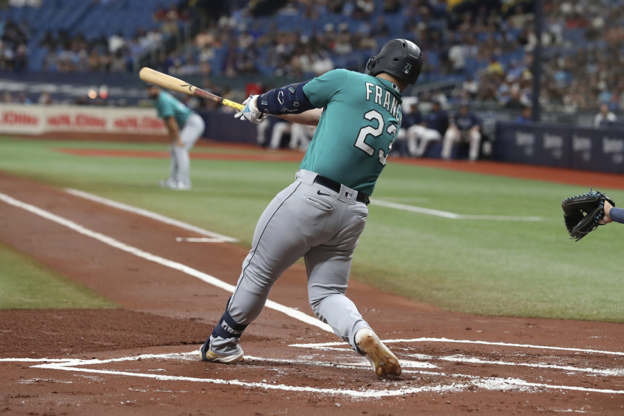 Seattle Mariners' Ty France hits a two-run RBI single against the Tampa Bay Rays during the first inning of a baseball game Saturday, Sept. 9, 2023, in St. Petersburg, Fla.