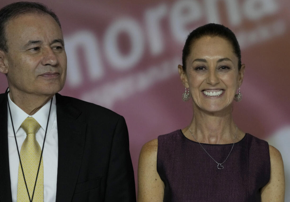 Mexican politicians Alfonso Durazo, left, and presumptive MORENA party presidential candidate Claudia Sheinbaum stand together during an event to announce the next party candidate in Mexico City, Wednesday, Sept. 6, 2023.