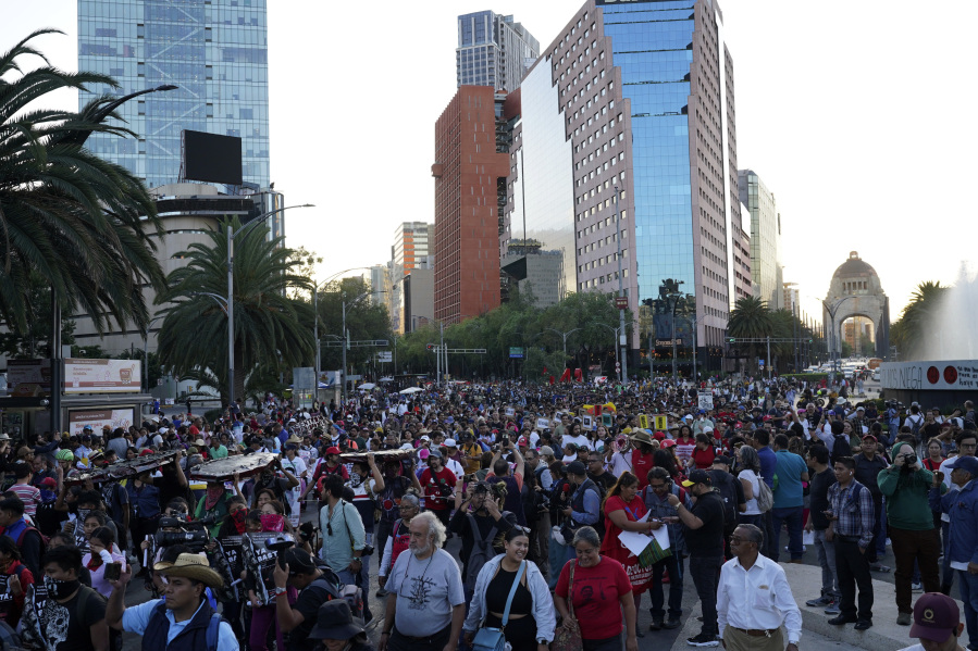 Relatives and sympathizers of 43 missing Ayotzinapa university students march on the 9th anniversary of their disappearance, in Mexico City, Tuesday, Sept. 26, 2023.