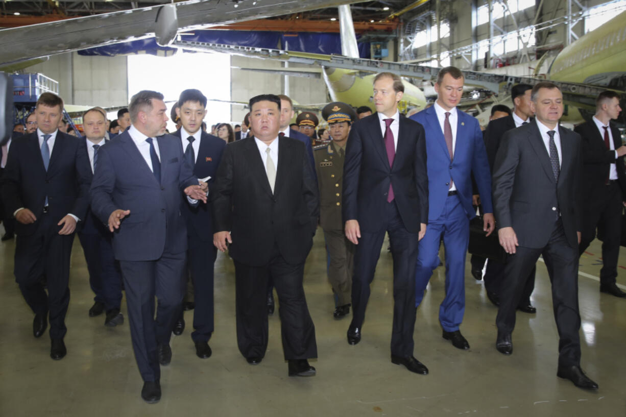 In this photo released by Khabarovsky Krai region government, North Korean leader Kim Jong Un, centre left, visits an aircraft plant "Production center "Yakovlev" that builds passenger planes Superjet-100, in Komsomolsk-on-Amur, about 6,200 kilometers (3,900 miles) east of Moscow, Russia, Friday, Sept. 15, 2023.