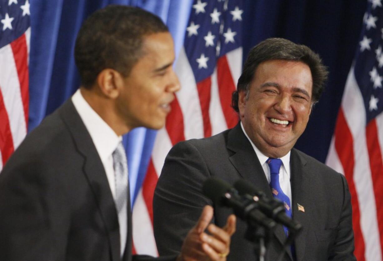 FILE - President-elect Barack Obama and Commerce Secretary designate New Mexico Gov. Bill Richardson laugh after a question was asked about Richardson's beard, Wednesday, Dec. 3, 2008, during a news conference in Chicago.  Richardson, a two-term Democratic governor of New Mexico who later was the U.S. ambassador to the United Nations and dedicated his post-political career to working to free Americans detained overseas, has died, Saturday, Sept. 2, 2023.