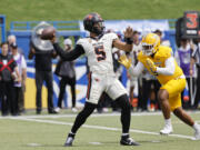 Oregon State quarterback DJ Uiagalelei (5) throws the ball as San Jose State defensive lineman Mata Hola (94) approaches in the first half of an NCAA college football game in San Jose, Calif., Sunday, Sept. 3, 2023.