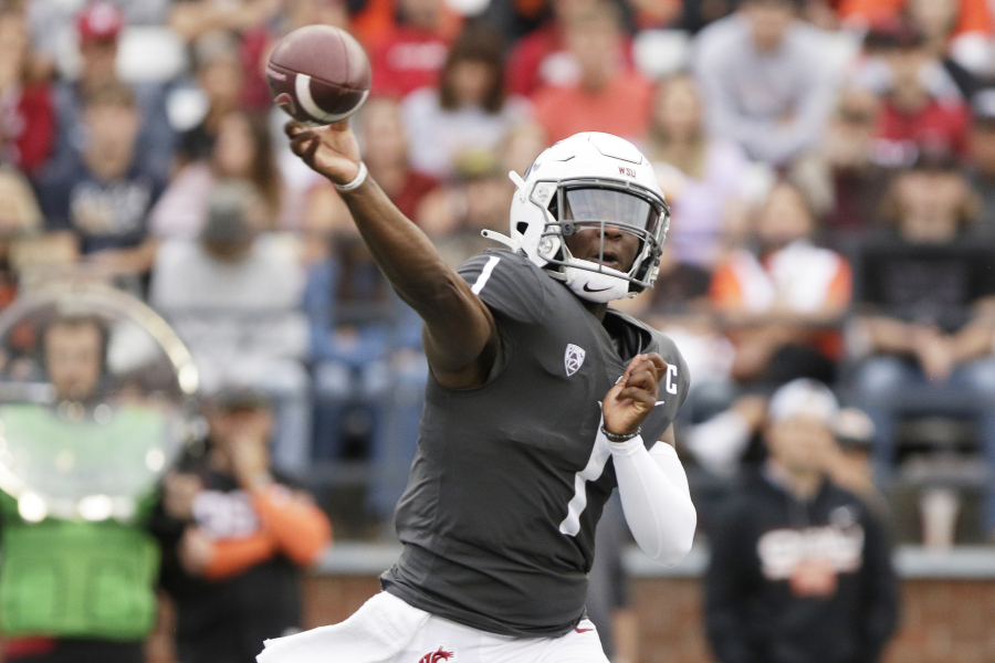 Washington State quarterback Cameron Ward throws a pass during the first half of an NCAA college football game against Oregon State, Saturday, Sept. 23, 2023, in Pullman, Wash.