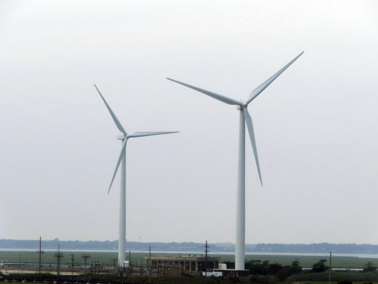 Land-based wind turbines in Atlantic City, N.J., turn on July 20, 2023. On Aug. 30, the offshore wind energy company Orsted said it is delaying its first offshore wind project in New Jersey until some time in 2026; it had previously been due to be completed by 2024.