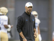 This photo provided by UCLA shows NCAA college football defensive coordinator D'Anton Lynn during practice in Los Angeles Aug. 9, 2023.