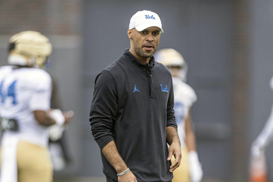 This photo provided by UCLA shows NCAA college football defensive coordinator D'Anton Lynn during practice in Los Angeles Aug. 9, 2023.