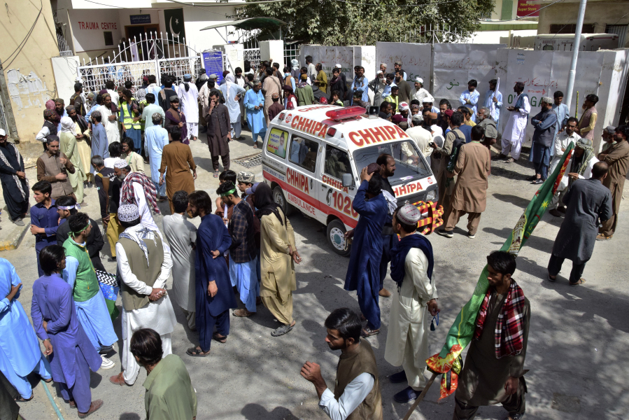 People gather at a hospital, where injured victims of a bomb explosion are brought, in Quetta, Pakistan, Friday, Sept. 29, 2023. A powerful bomb exploded at a rally celebrating the birthday of Islam's Prophet Muhammad in southwest Pakistan on Friday, killing multiple people and wounding dozens of others, police and a government official said.