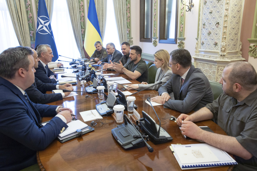 NATO Secretary General Jens Stoltenberg, center left, and Ukrainian President Volodymyr Zelenskyy center right, talk during their meeting in Kyiv, Ukraine, Thursday, Sept. 28, 2023.