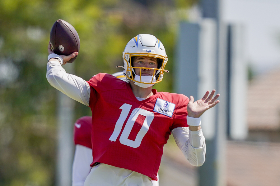 Los Angeles Chargers quarterback Justin Herbert throws during a joint NFL football practice with the New Orleans Saints, Thursday, Aug. 17, 2023, in Costa Mesa, Calif.