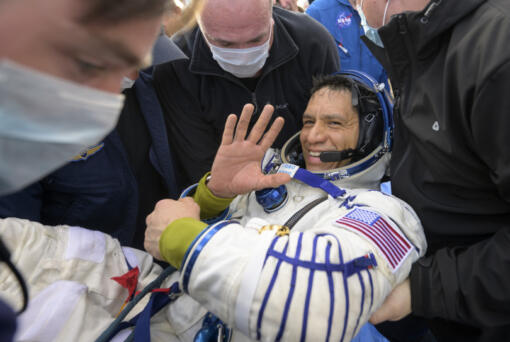 NASA astronaut Frank Rubio is helped out of the Soyuz MS-23 spacecraft just minutes after he and Russian cosmonauts Sergey Prokopyev and Dmitri Petelin, landed in a remote area near the town of Zhezkazgan, Kazakhstan on Wednesday, Sept. 27, 2023.  The extended mission means that Rubio now holds the record for longest spaceflight by an American. (Bill Ingalls/NASA via AP)