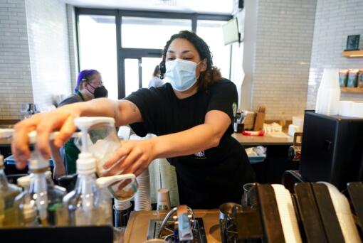 Sada VanQuekelberg makes a drink at a Starbucks retail location, Wednesday, June 28, 2023, in Seattle.
