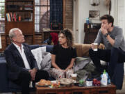 This image released by Paramount+ shows Kelsey Grammer as Frasier Crane, left, Jess Salgueiro as Eve, center, and Jack Cutmore-Scott as Freddy in a scene from "Frasier." (Chris Haston/Paramount+ via AP)
