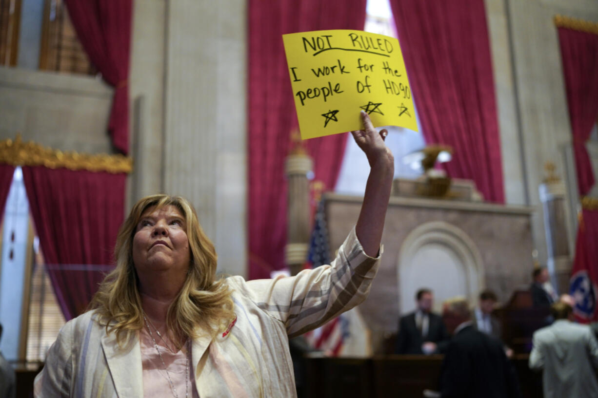 Rep. Gloria Johnson, D-Knoxville, holds a sign on the House floor after a special session of the state legislature on public safety adjourned Tuesday, Aug. 29, 2023, in Nashville, Tenn.