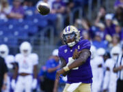 Washington quarterback Michael Penix Jr. throws against Tulsa during the first half of an NCAA college football game Saturday, Sept. 9, 2023, in Seattle.